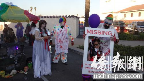 “妖魔鬼怪”把“小天使”裝入“尋人啟事”的方框中。(美國《僑報》)