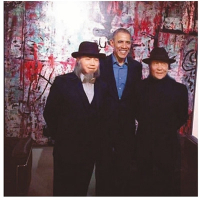 圖為周氏兄弟與奧巴馬合照。 　　資料圖片