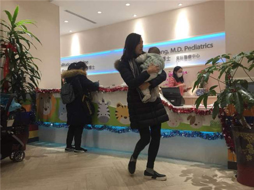 流感肆虐，各個診所在27日都出現(xiàn)了看診潮。(美國《世界日報》/曹健攝)