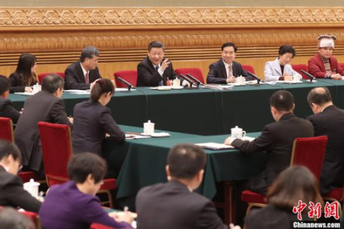 3月7日，中共中央總書記、國家主席、中央軍委主席習近平參加十三屆全國人大一次會議廣東代表團的審議。<a target='_blank' >中新社</a>記者 盛佳鵬 攝