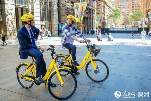 中國(guó)僑網(wǎng)“小黃車”駛?cè)氚拇罄麃?,為共享?jīng)濟(jì)添活力。(人民網(wǎng) 資料圖)